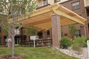 St Michael apartment for rent - a covered patio with a table and a grill