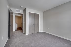 St. Michael apartment for rent - a bedroom with a closet and a door to a hallway