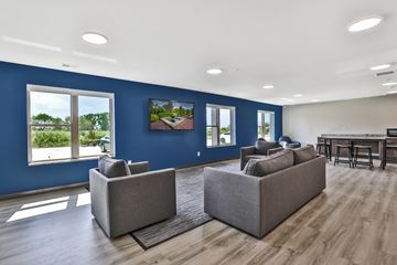 Kasson apartment for rent - A living room with two grey couches and a wooden floor.