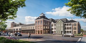 West Hempstead townhouse for rent - A street view of a large building with a clock tower.