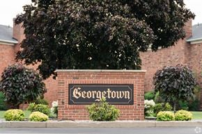 Williamsville townhouse for rent - A brick sign that says Georgetown is in front of a building.