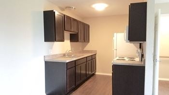 Newly remodeled cupboards, appliances, flooring, windows, doors.