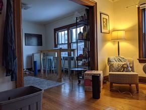 Madison apartment for rent - A room with a chair and a table in it.