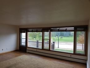 Monona apartment for rent - A room with a large window and a view of a street.