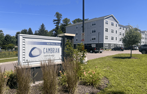 Wisconsin Dells apartment for rent - A Cambrian Community sign is in front of a building.