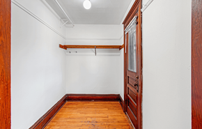 Madison apartment for rent - A room with a wooden floor and a white wall.