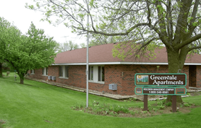 Cambridge apartment for rent - A sign for Greenwale Apartments is in front of a brick building.