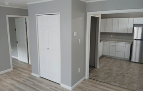 Leroy apartment for rent - A kitchen with white cabinets and a refrigerator.