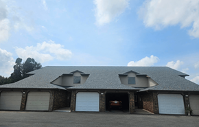 Deforest apartment for rent - A house with a garage and a brick wall.