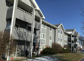 Marshall apartment for rent - Apartment building with grey siding and white trim.