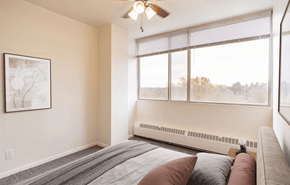 Madison apartment for rent - A bedroom with a large bed and a ceiling fan.