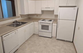 Greenfield apartment for rent - a white kitchen with white appliances and white cabinets