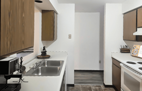 Marshall apartment for rent - A modern kitchen with a white countertop and brown cabinets.
