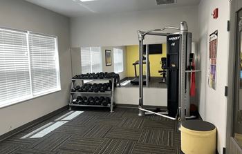 Fitness center with adjacent children's play place