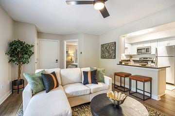 Newport News apartment for rent - A living room with a white couch and a coffee table.