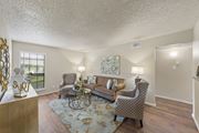 Temple apartment for rent - a living room with couches and chairs and a rug at Parks on the Green, Texas, 76504