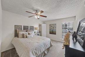Temple apartment for rent - Master bedroom with ceiling fan and decor at Parks on the Green Apartments, Temple, Texas