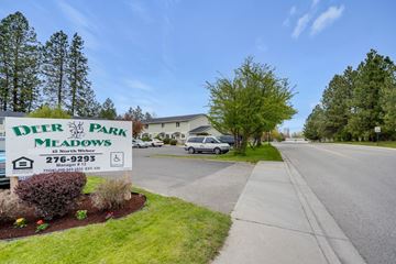 Deer Park apartment for rent - a sign for deer park meadows on the side of a street