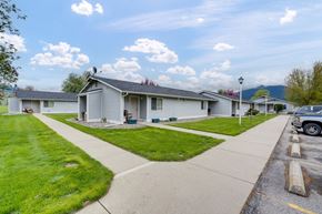 Kettle Falls apartment for rent - a white house with a sidewalk in front of it