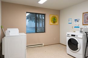 Newport apartment for rent - a laundry room with a washer and a dryer in it and a window