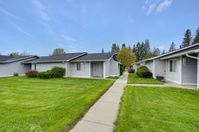 Deer Park apartment for rent - a row of white houses on the side of a sidewalk