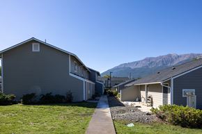 Joseph apartment for rent - A row of houses with a mountain in the background.