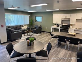 Chino Valley apartment for rent - A modern living room with a dining area and kitchen in the background.