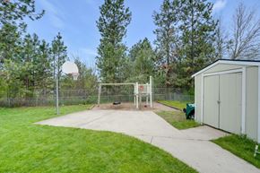 Deer Park apartment for rent - the backyard has a basketball court and a shed with a basketball hoop