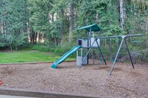 Priest River apartment for rent - a swing set with a slide in a park