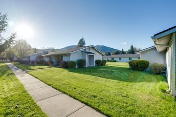 Rathdrum apartment for rent - a row of houses with grass and a sidewalk