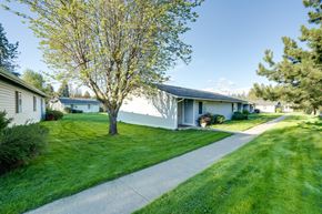 Rathdrum apartment for rent - a white house with a sidewalk in front of it