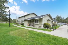 Newport apartment for rent - the front of a house with a sidewalk and a lawn