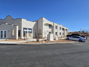 Huachuca City apartment for rent - A modern building with a car parked in front.