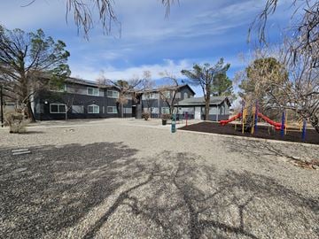 Cottonwood apartment for rent - A playground with a slide and a building in the background.