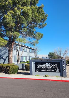Chino Valley apartment for rent - A sign for Granite Point Apartments sits in front of a building.