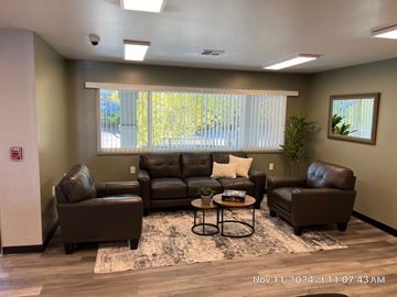 Chino Valley apartment for rent - A living room with brown leather furniture and a rug.