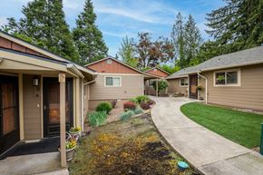Salem apartment for rent - A row of houses with a green lawn in front.