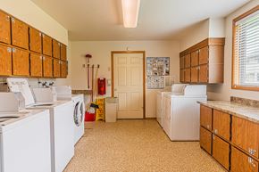 Sutherlin apartment for rent - a kitchen with washer and dryers and a door to a closet