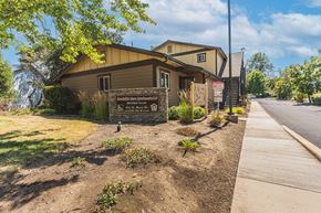 Phoenix apartment for rent - a building with a sign on the side of a sidewalk