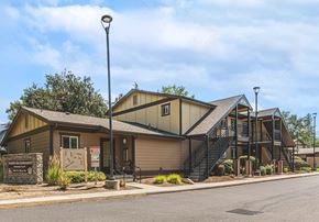 Phoenix apartment for rent - the front of a house with a street sign in front of it