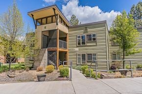 Bend apartment for rent - A two-story house with a balcony on the upper floor.