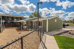 Eagle Point apartment for rent - a building with a fenced in yard and a fence