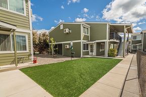 Eagle Point apartment for rent - a view of a yard in front of two apartment buildings