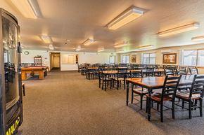 Grants Pass apartment for rent - a dining room with tables and chairs and a pool table