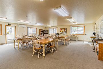 Talent apartment for rent - a large room with tables and chairs and a kitchen