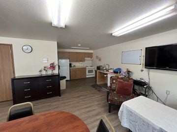 Prosser apartment for rent - a kitchen and living room with a table and a chair