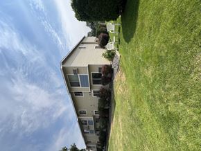 Prosser apartment for rent - the view of a building from the top of a grass field