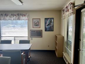 Cle Elum apartment for rent - a dining room with a table and chairs and a window
