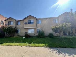 Cle Elum apartment for rent - a house with a yard in front of a sidewalk