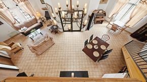 Bisbee apartment for rent - A living room with a chandelier, couches, and a coffee table.